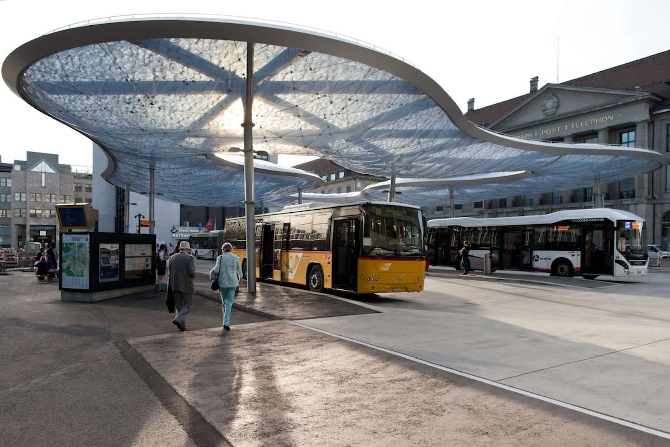 Bus terminal and train station square by Vehovar