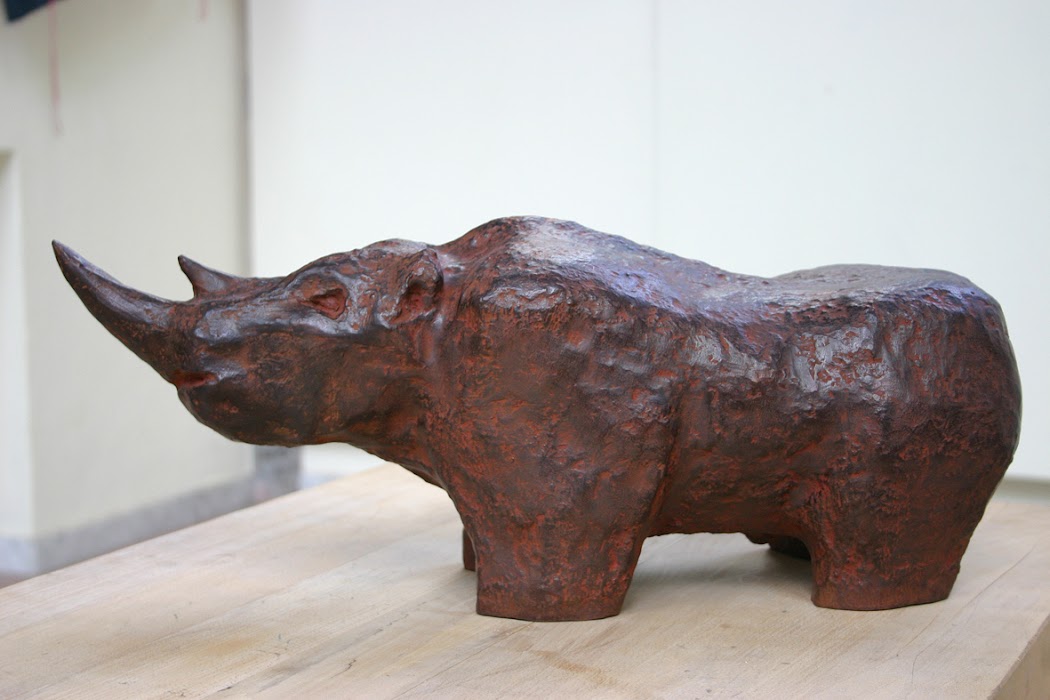 rhinoceros (sculpture by franka waaldijk, left)