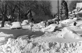 Cars are buried under the heavy snow in Denver. Scroll down for a photo slideshow with more images. (Denver Public Library Digital Collection)