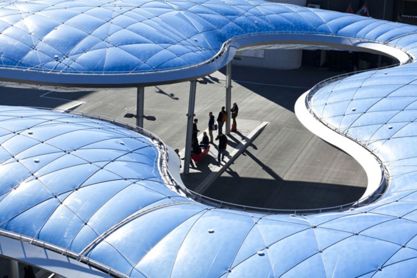 Bus terminal and train station square by Vehovar