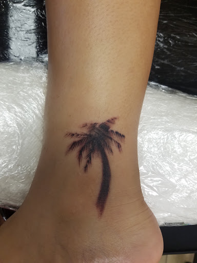 Tattoo Shop «magnum opus tattoo company», reviews and photos, 1817 Padre Blvd #4, South Padre Island, TX 78597, USA