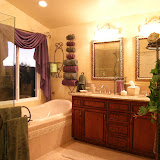 Pramik Master Bath - This romantic bathroom contains a new larger window. The shower, tub, vanity, mirror, lighting, flooring, and paint are new.