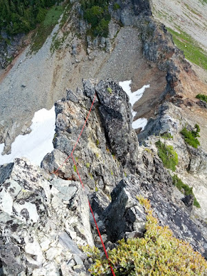 Looking down at the traverse across the notch from my belay at the horn