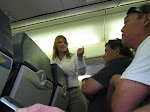 the stewardess who stood up for the other then invited the guy's friend to leave