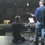 Scott volunteers as lyrics holder for this practice