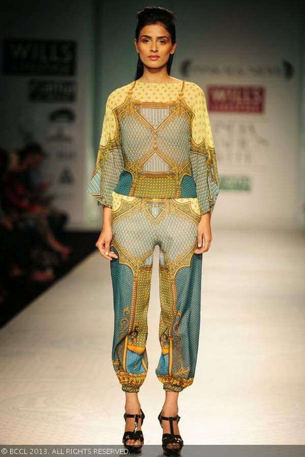 A model walks the ramp for designer duo Pankaj and Nidhi on Day 2 of the Wills Lifestyle India Fashion Week (WIFW) Spring/Summer 2014, held in Delhi.