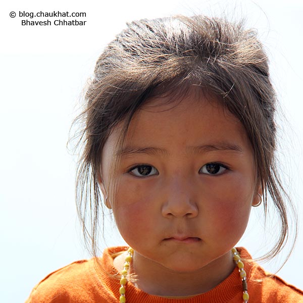 Close-up portrait of a super cute baby from high altitude, perhaps from Nepal