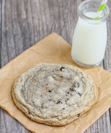 photo of a cookie with a glass of milk