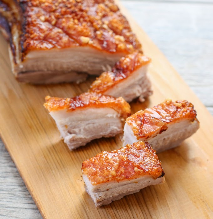 a close-up photo of sliced crunchy skin pork belly