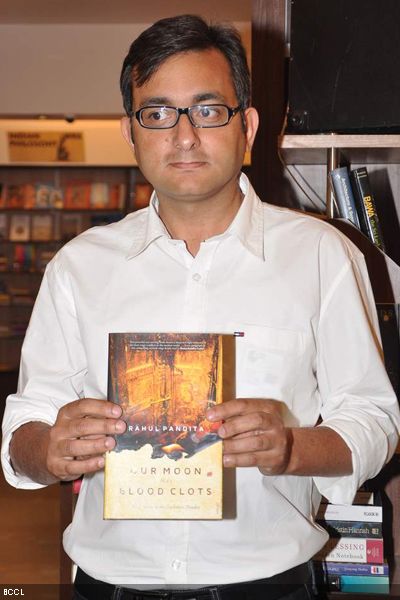 Author Rahul Pandita with his latest book 'Our Moon Has Blood Clots' during its launch, held at Title Waves Book Store in Mumbai on February 4, 2013. (Pic: Viral Bhayani)
