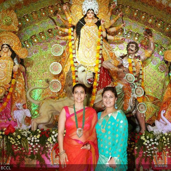 Kajol with cousin sister Sharbani Mukherjee during North Bengal Sarbajanin Durga Puja celebrations, held at Tulip Star, in Mumbai, on October 11, 2013.