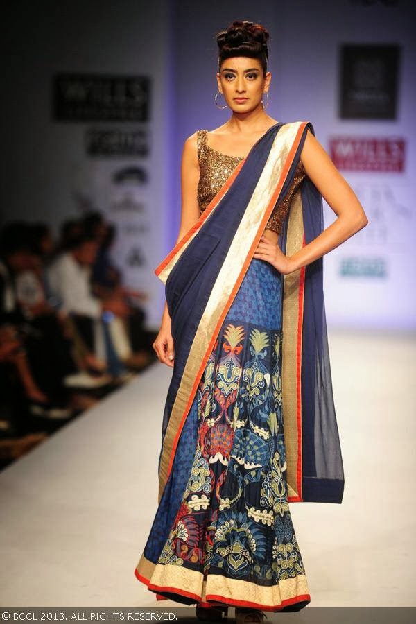 Binal displays a creation by fashion designers Ashish Viral and Vikrant on Day 5 of Wills Lifestyle India Fashion Week (WIFW) Spring/Summer 2014, held in Delhi. 