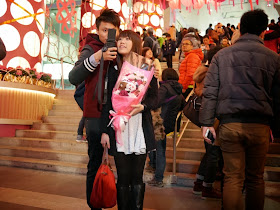 young couple taking a Valentine's Day selfie