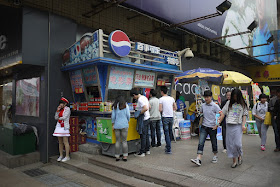 young woman for a promotion standing next to a Pepsi stand
