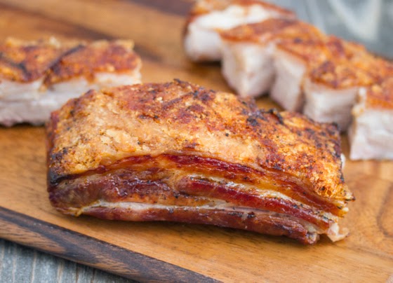 a large piece of pork belly with crispy skin