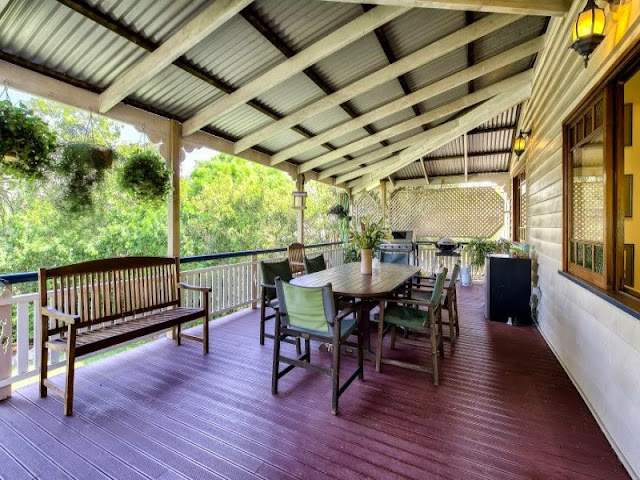 Verandah rafters end in a characteristic style of Federation awnings, and filigree screen is very ornamental