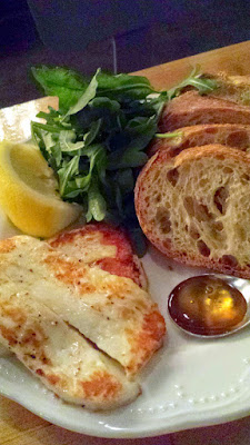 Cheese & Crack Snack Special of Grilled Halloumi with seared halloumi cheese, toast, honey, lemon and greens.