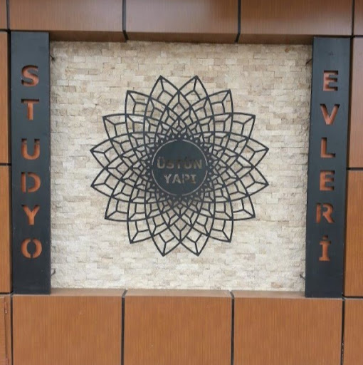 Üstün Stüdyo Evleri logo