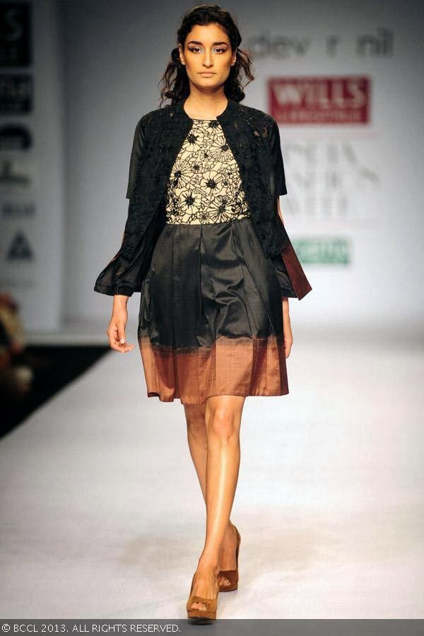 Miss India Kanishtha Dhankar walks the ramp for fashion designers Dev r Nil on Day 3 of the Wills Lifestyle India Fashion Week (WIFW) Spring/Summer 2014, held in Delhi.