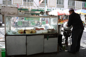 man preparing a soup in Yinchuan, China