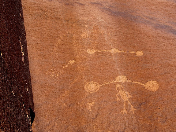 Faintly-abraded figure with some petroglyphs