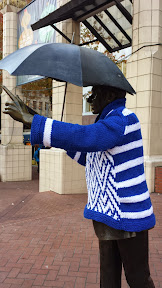 #UglySweaterPDX campaign, 2014: Some of downtown’s most iconic sculptures will don their holiday finery for the season. In the Pioneer District on Southwest Yamhill and Morrison streets (between Fifth and Sixth avenues), you’ll see Animals in Pools, Allow Me (aka “Umbrella man”) and Kvinneakt dressed up in festive ugly sweaters.