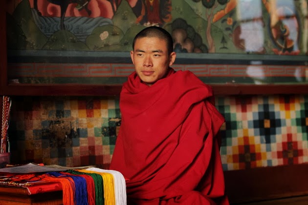 Buddhist Monk in front of temple inside Paro Dzong