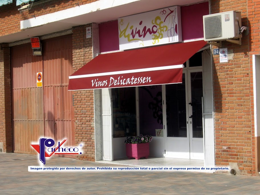 Toldo de brazo extensible para una tienda en Godelleta