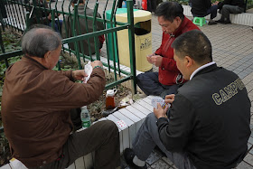 men playing a card game in Changsha, China