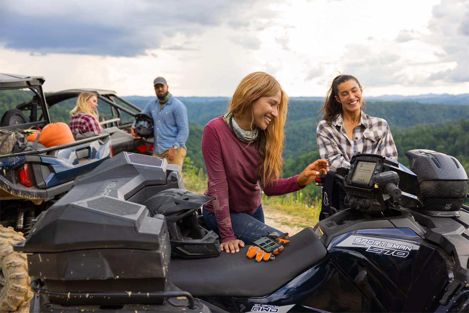 Gear up for a thrilling family adventure as they prepare to hit the woods on their trusty POLARIS ATVs