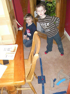 train track on the floor between 2 rooms