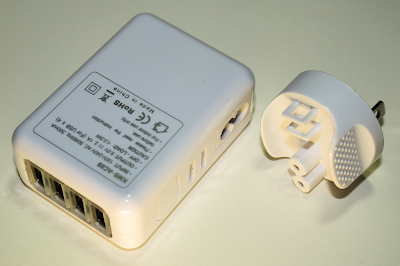 The KMS TC-09 (AC09) 4-port USB charger. The power plug can be interchanged for use in different countries.