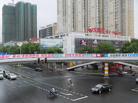 pedestrian bridge over a large intersection with a KFC at RT Mart in Changde