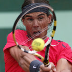 Spain's Rafael Nadal hits a return to Argentina's Juan Monaco during their Men's Singles 4th Round tennis match of the French Open tennis tournament at the Roland Garros stadium, on June 4, 2012 in Paris.    AFP PHOTO / PATRICK KOVARIK        (Photo credit should read PATRICK KOVARIK/AFP/GettyImages)