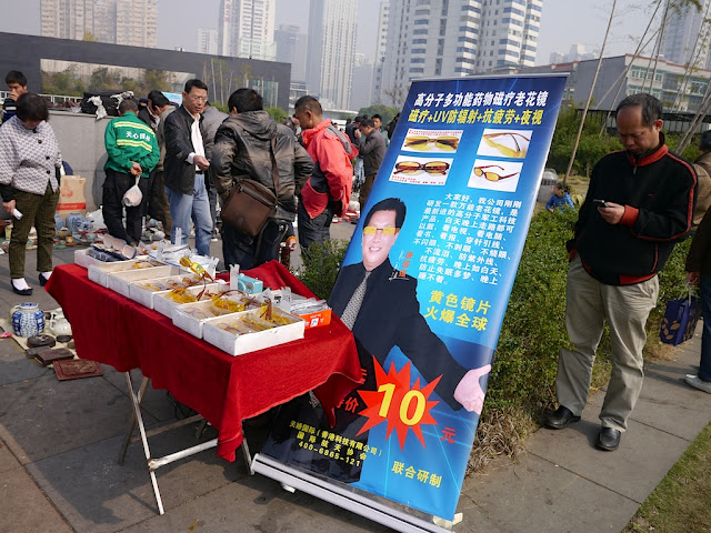 UV protecting glasses for sale at an outdoor antique market in Changsha, China