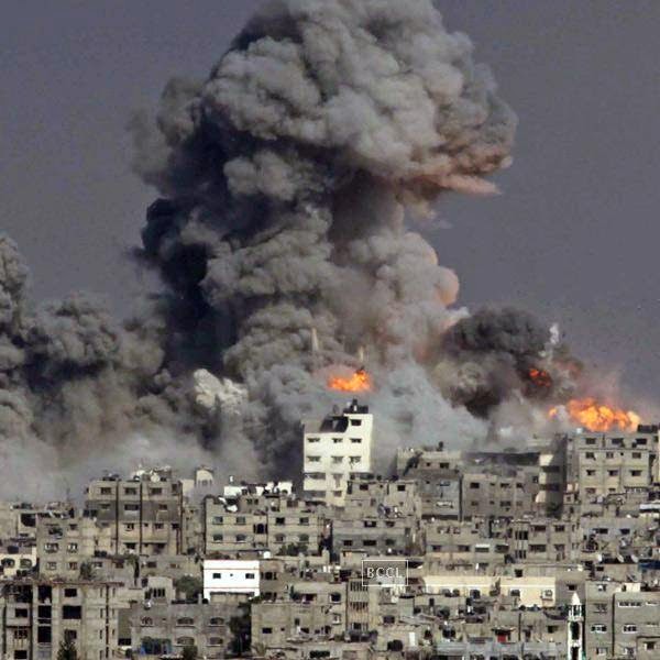 Heavy smoke and fire billow following an Israeli military strike in Gaza City.