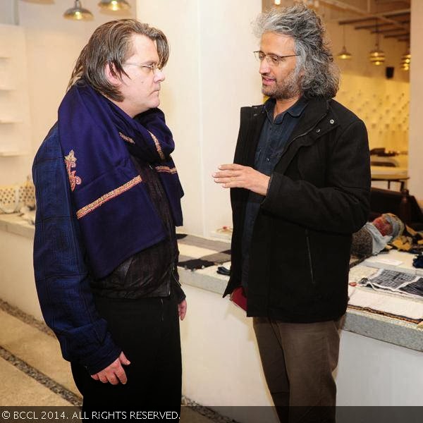 Samar Jodha (R)with a guest during the Be Open exhibition, held at IGNCA, Janpath, New Delhi, on February 10, 2014.