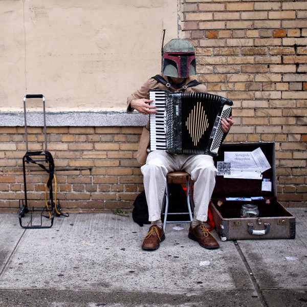 A costumed fan plays the accordion outside New York's Comic-Con convention.