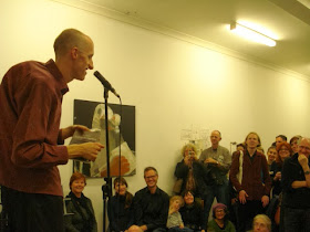 Andy Jackson performing poetry in front of an audience 