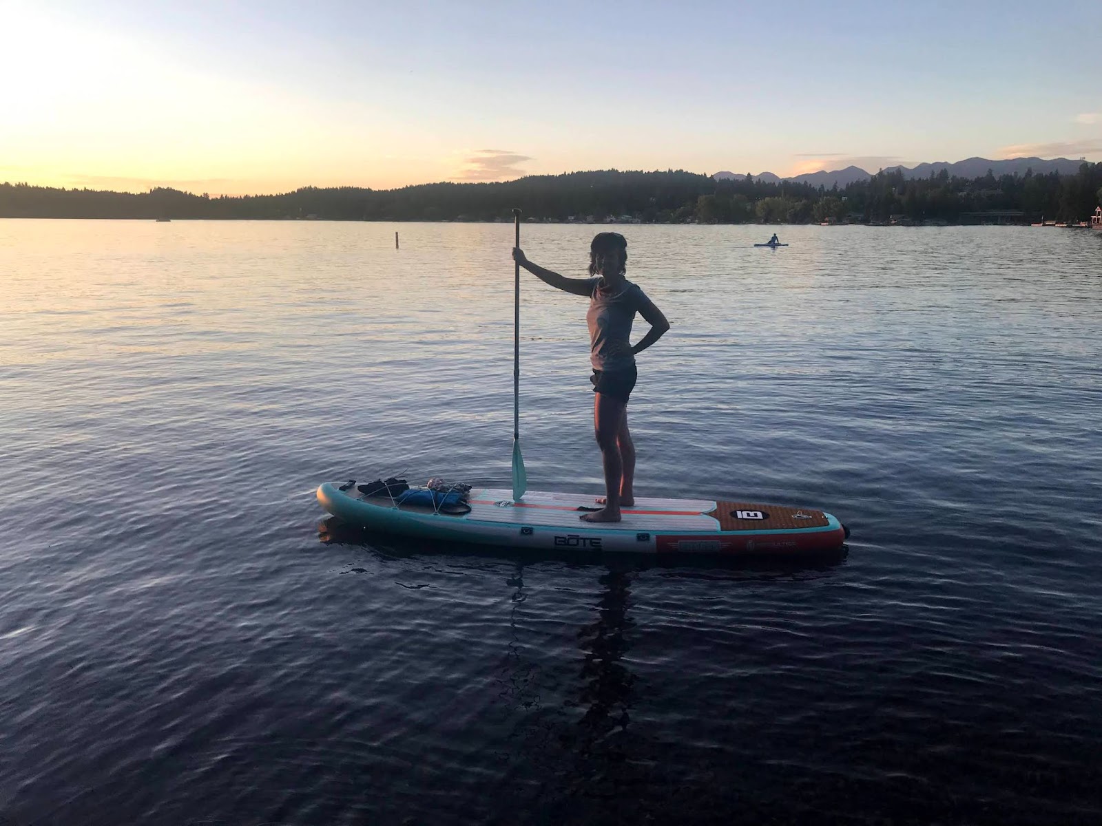 Person paddle boarding on Flathead Lake
