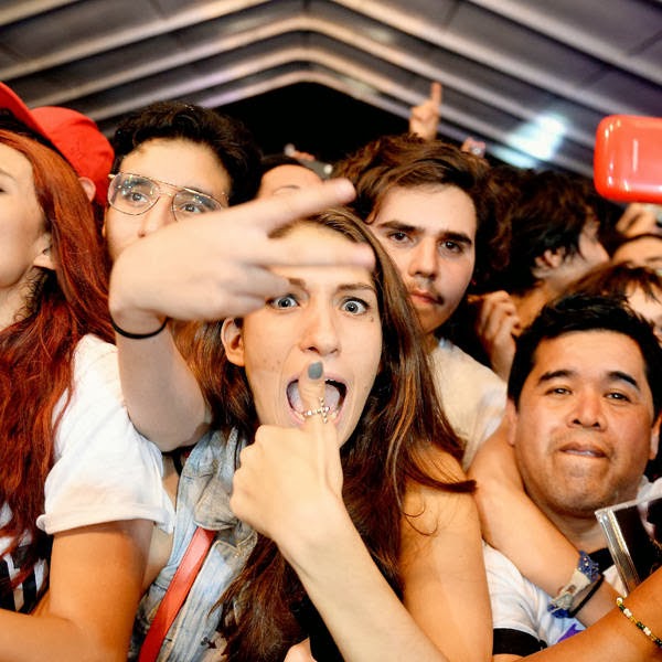 Fans of US singer Blondie enjoy the performance during the first day of Corona Capital Music Fest at the Autodromo Hernmanos Rodriguez, in Mexico City, on October 12, 2013.