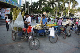 tricycle carts in China with a items such as sugar cane and jackfruit