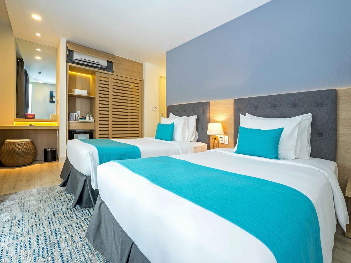 Giường trong phòng chung tại Oceanami Villas & Beach Club