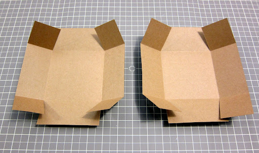 I then cut along the short folds at either end of each box piece and folded the flaps up. You can see the box taking shape!