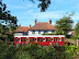 Old railway carriage in a garden to a domestic house at High Kelling