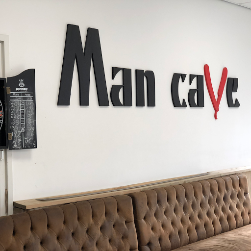 Man Cave Haircuts logo
