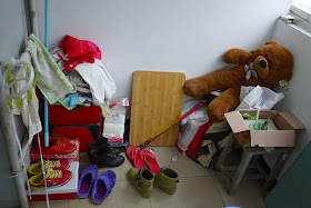 stuffed bearr, shoes, and other items inside a female dormitory room at Central South University of Forestry and Technology in Changsha, China.