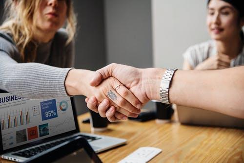 Close-Up Photography of People Shaking Hands