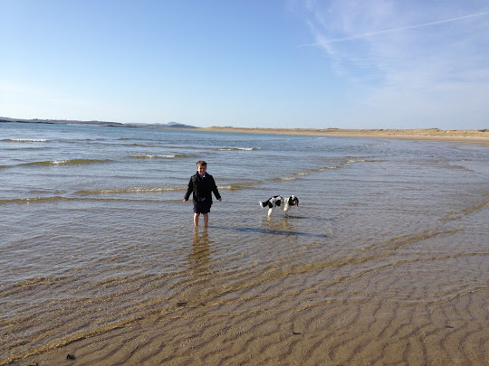 Ben Roters and Charlie Brown American cocker spaniel, having a paddle
