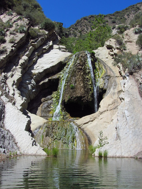 a water fall like a huge, gaping mouth